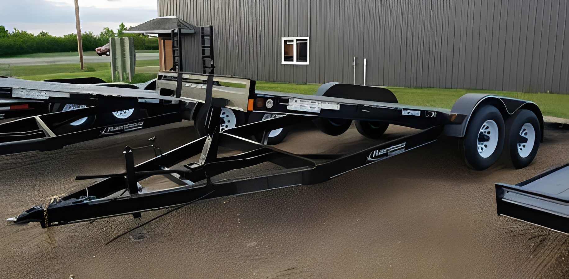 Empty utility trailer in parking lot