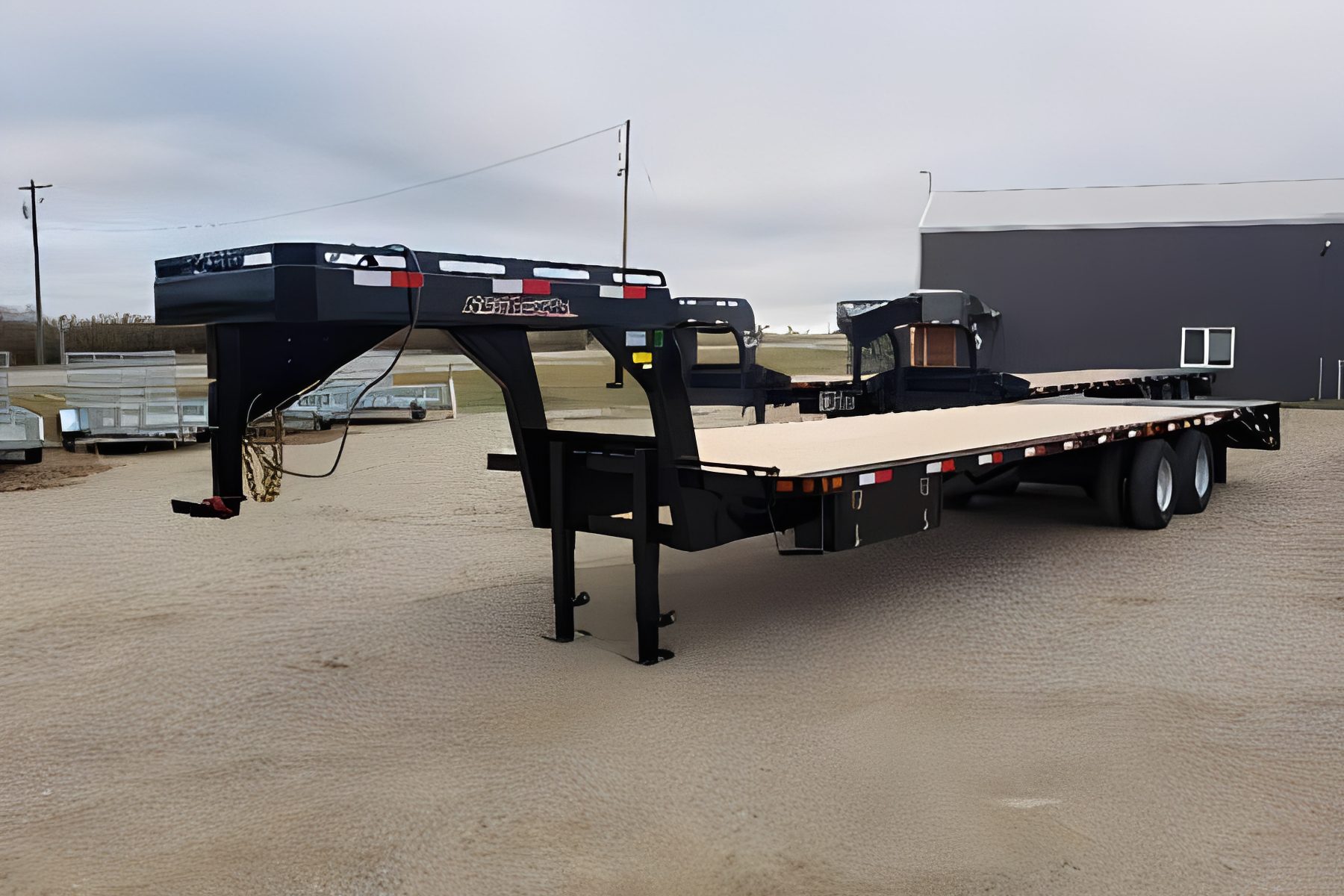 Large black flatbed trailer