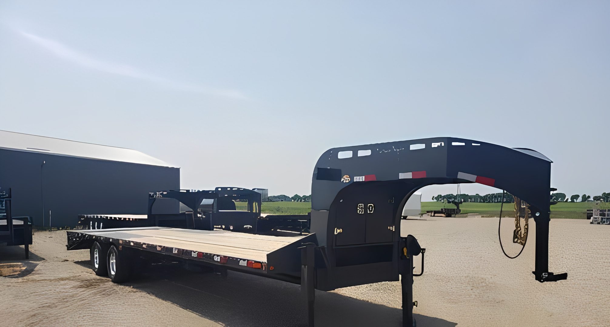 Heavy-duty trailer on gravel lot