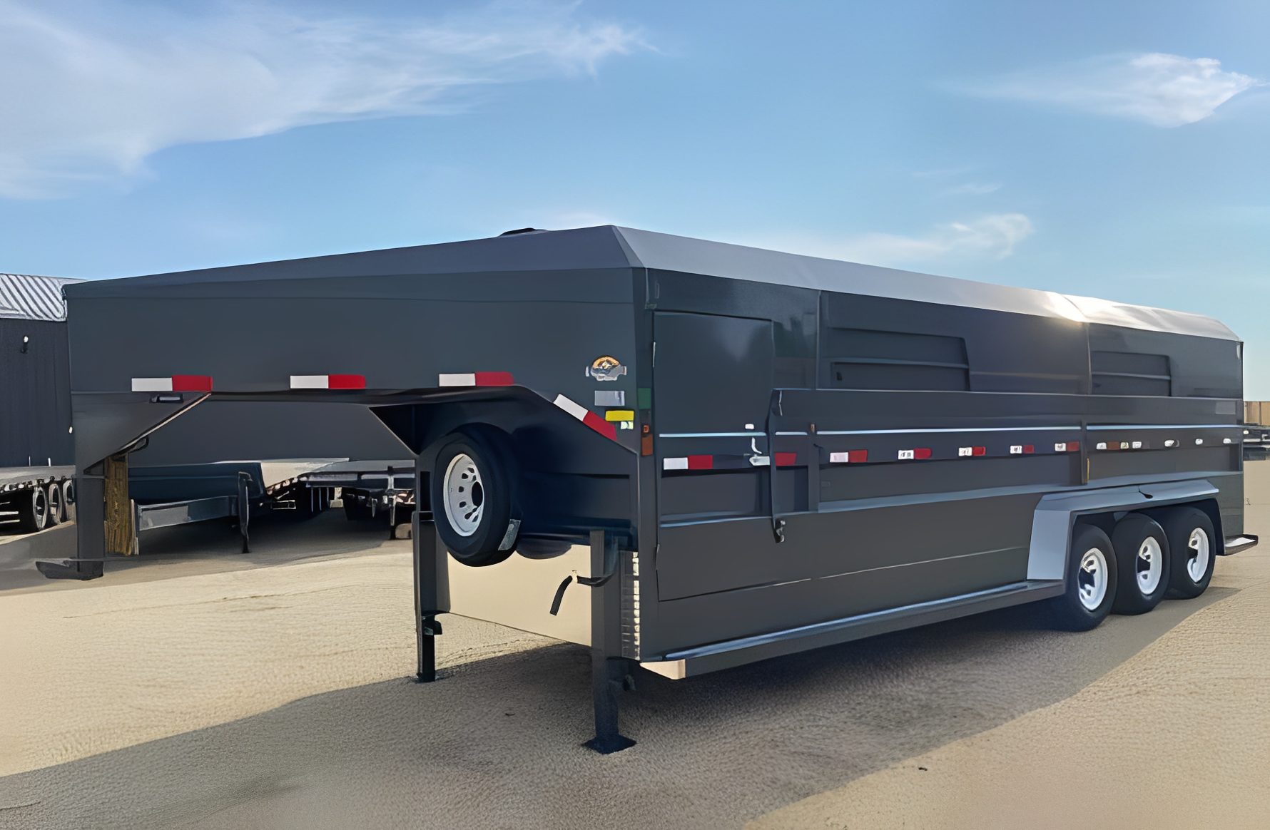 Heavy-duty livestock trailer with red accents