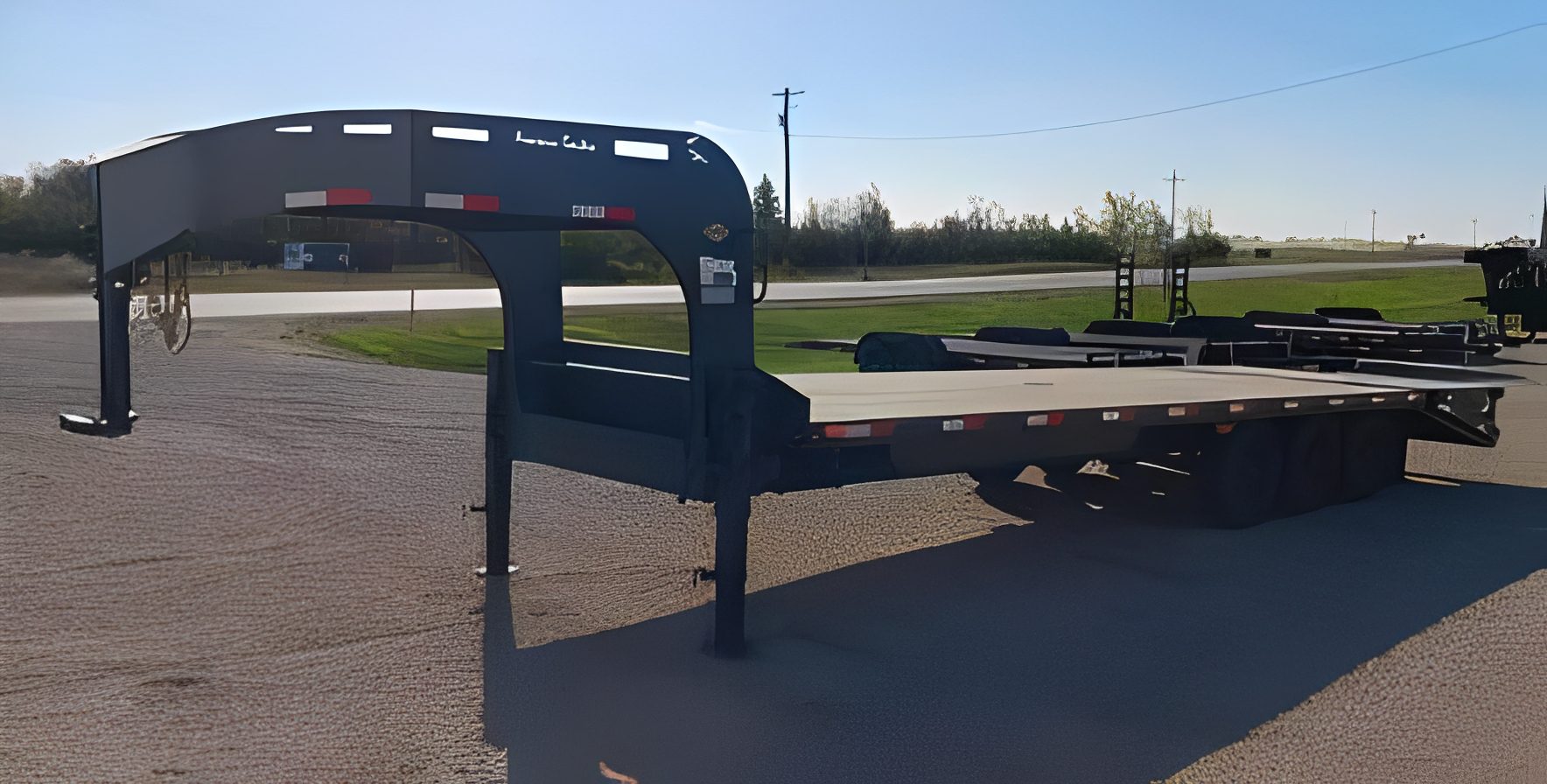 Industrial trailer under clear blue sky.