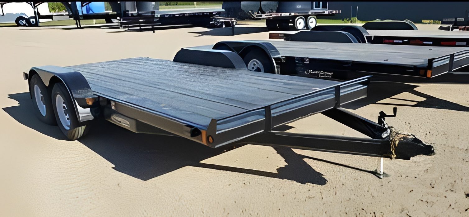 Flatbed trailer parked on sandy ground