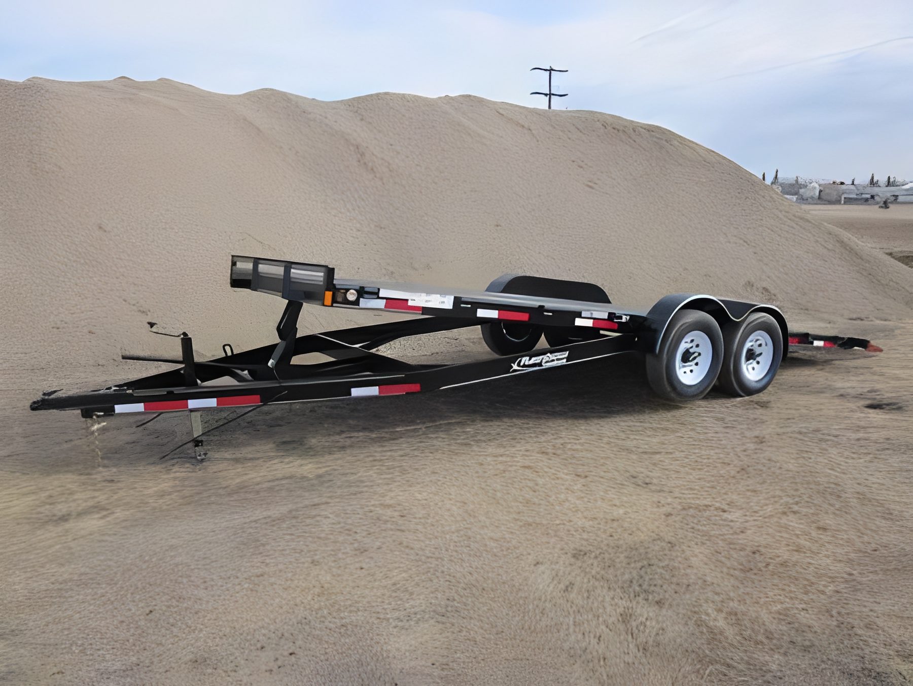 Car trailer parked on dirt
