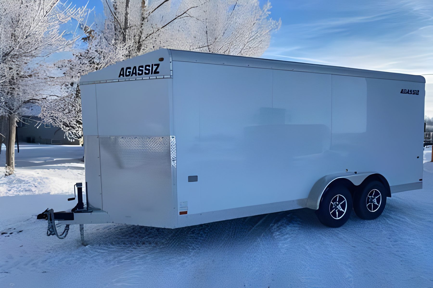 White enclosed trailer on snowy ground