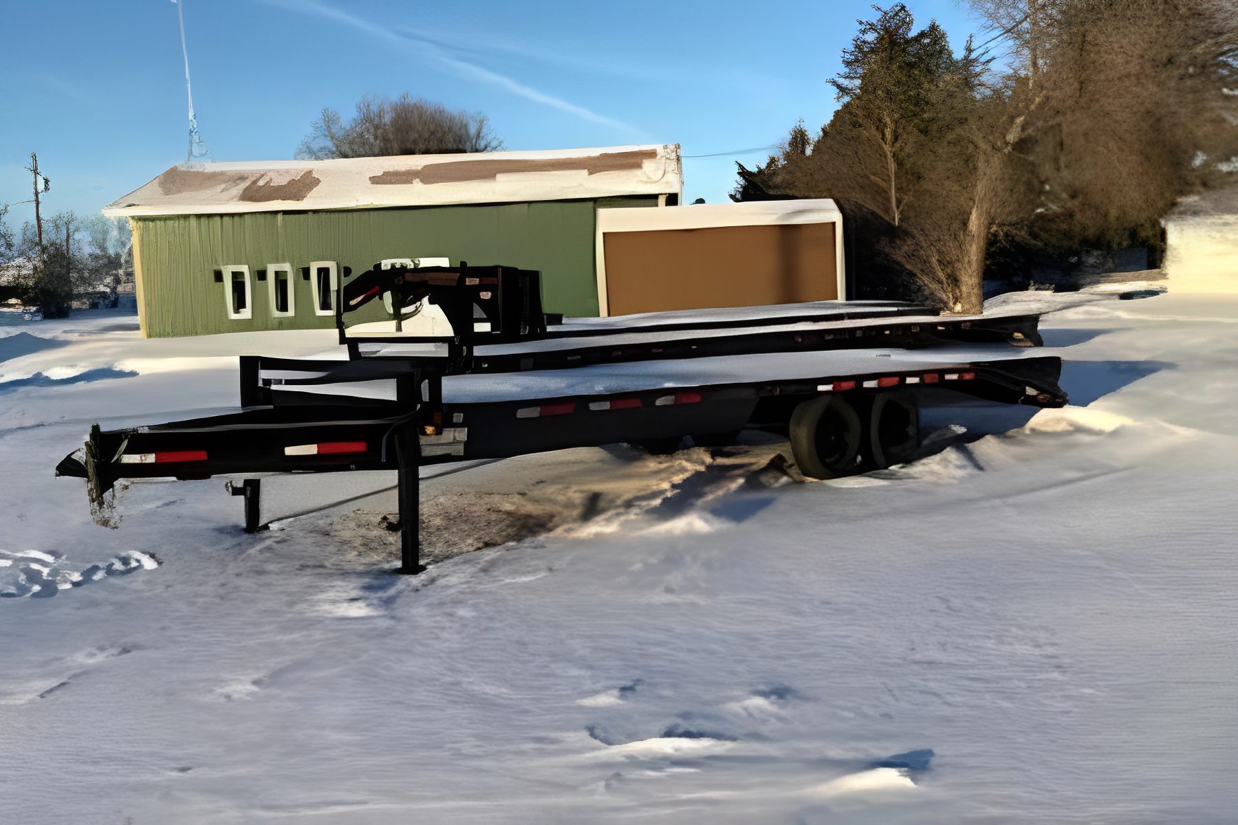 Flatbed trailer in snowy yard