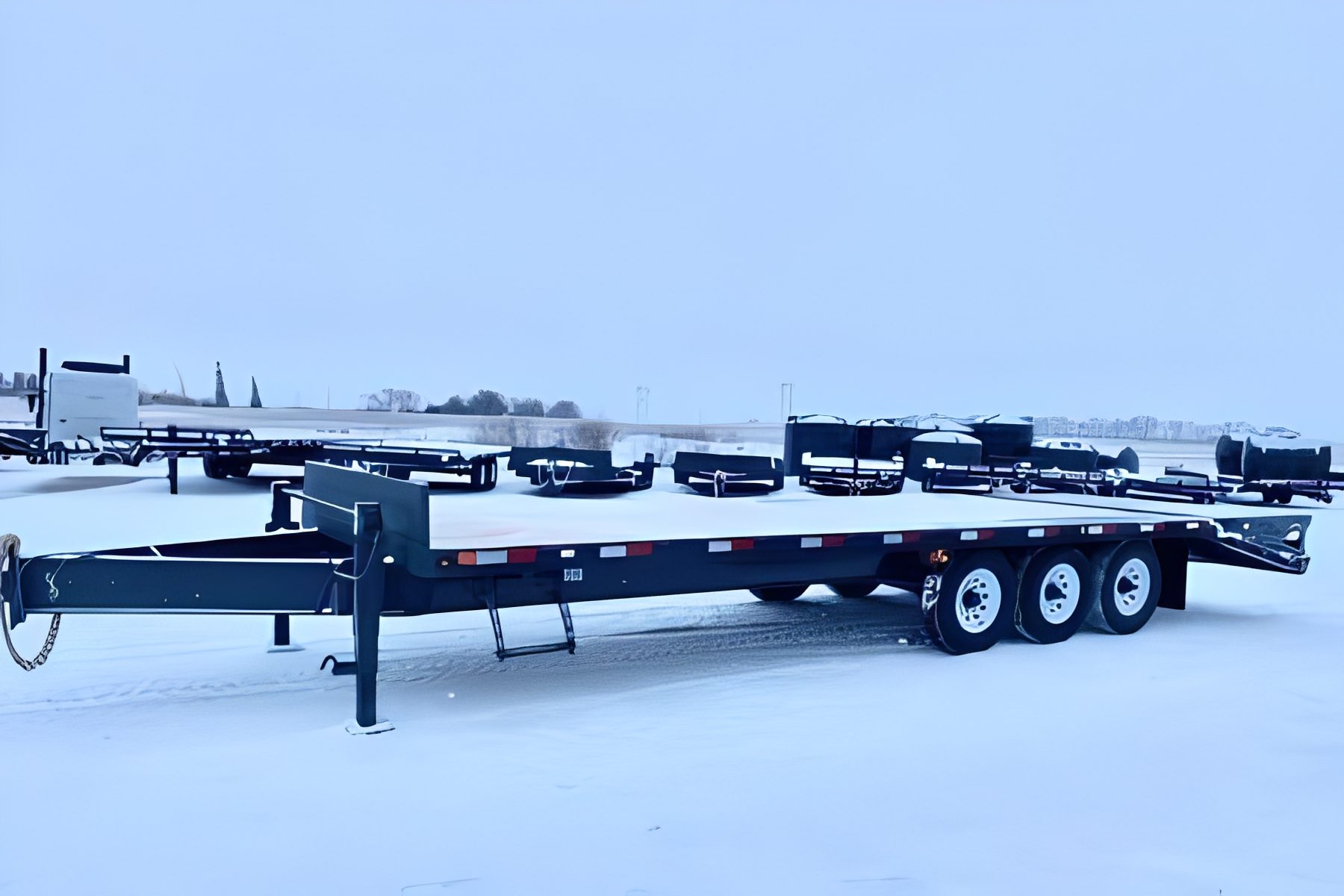 Flatbed trailer on snowy ground