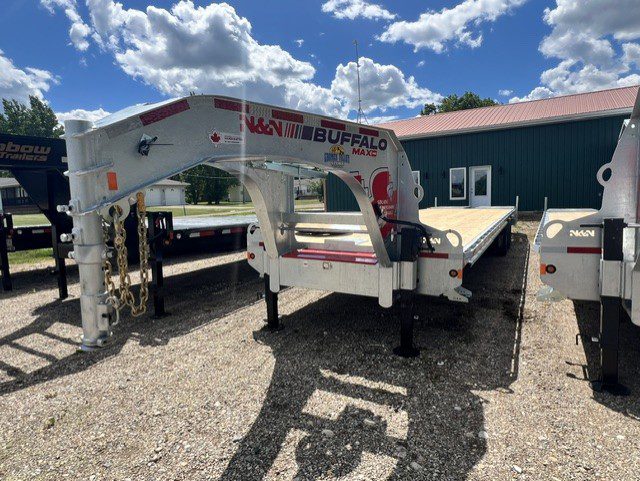 White Buffalo gooseneck flatbed trailer parked